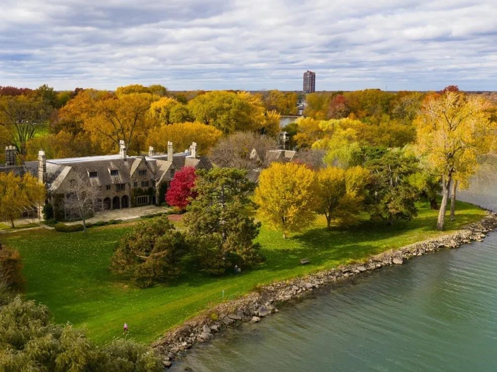 Ford House estate aerial view at dusk with illuminated grounds and Lake St. Clair