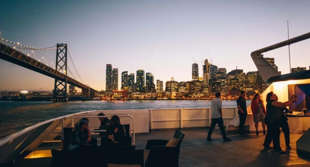 San Francisco Spirit upper deck at dusk with Bay Bridge and city skyline