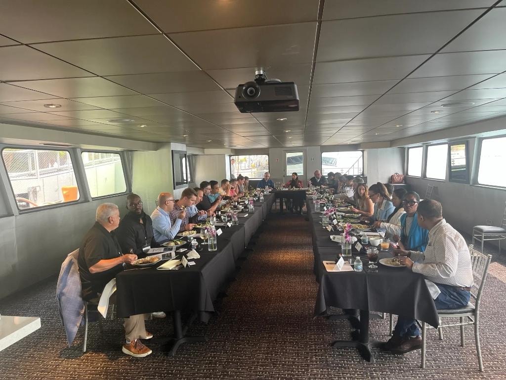 Executive dining session aboard the San Francisco Spirit with attendees at long tables